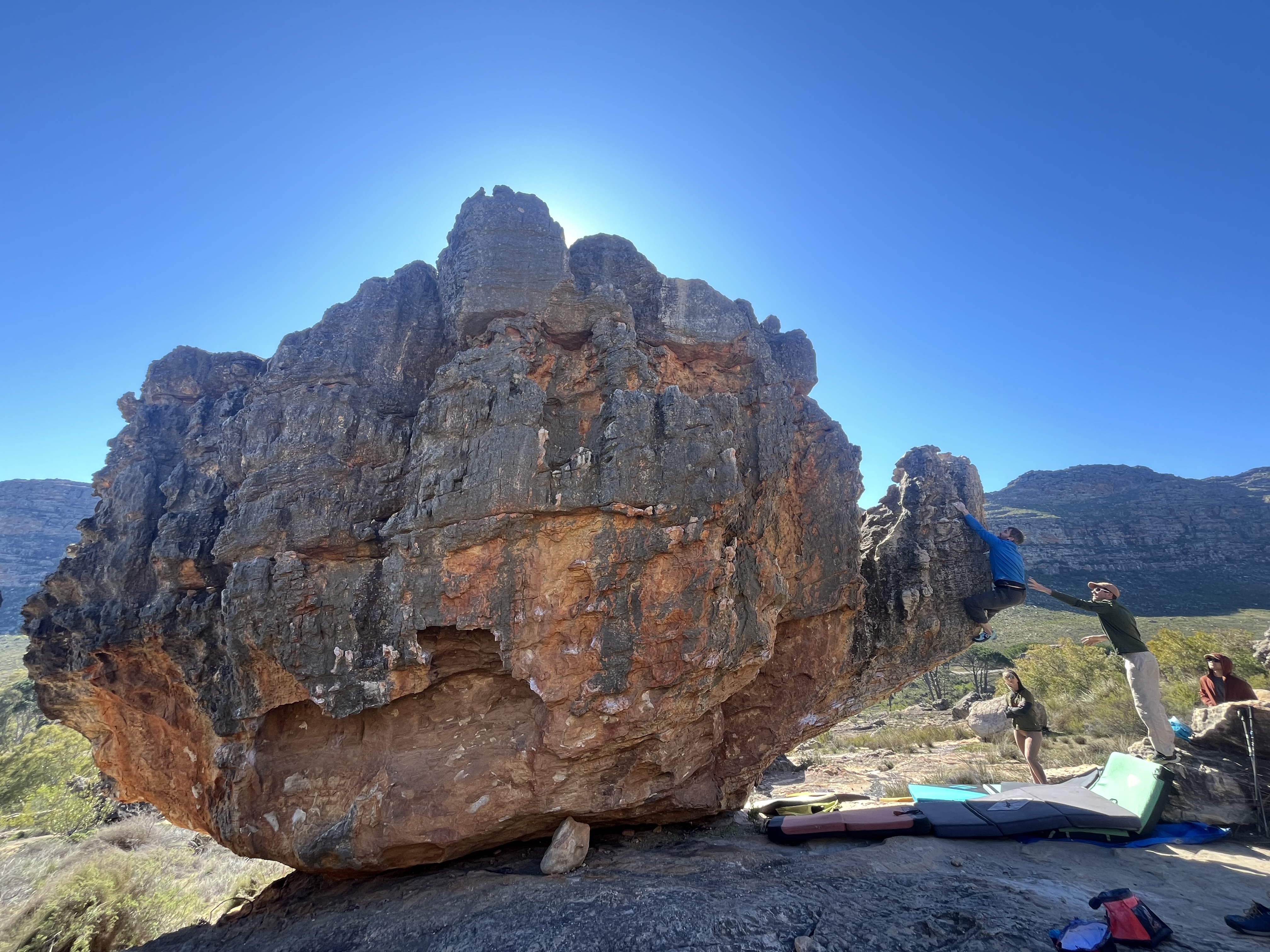 Image of a climber on Up the Spout, Teapot boulder in Rocklands, Cederberg South Africa.